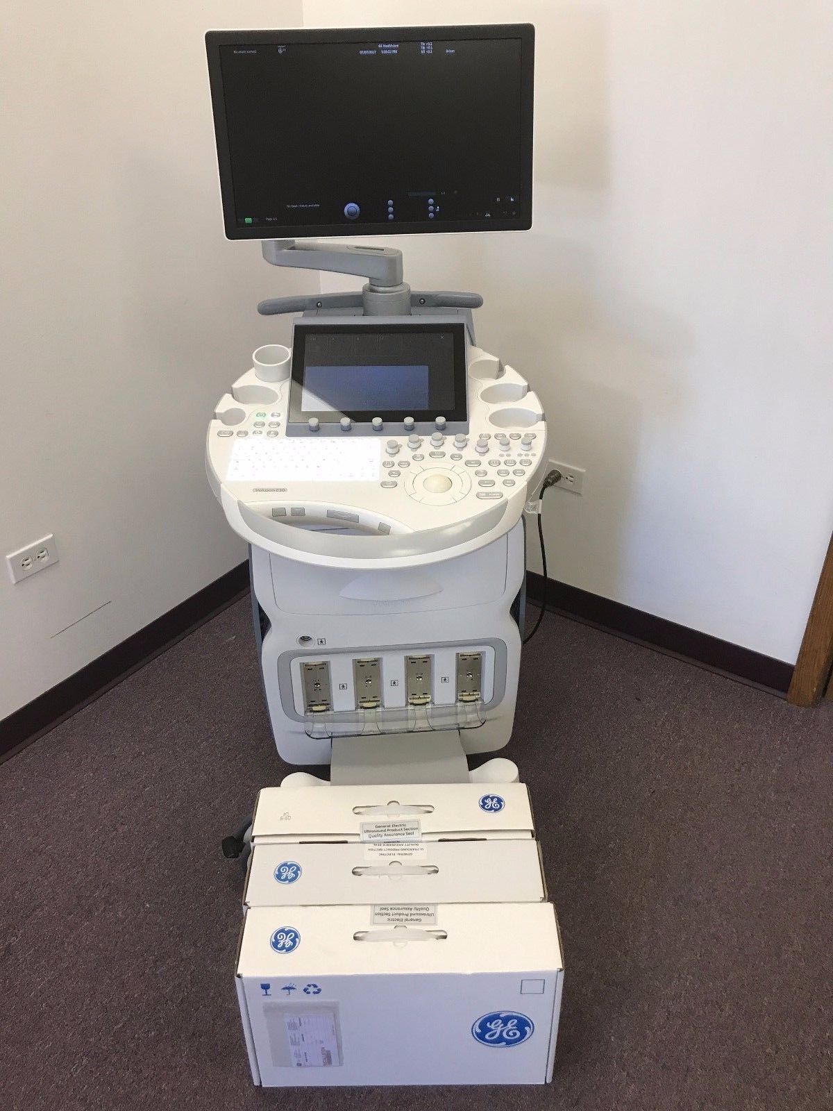 a medical machine with a monitor on top of it