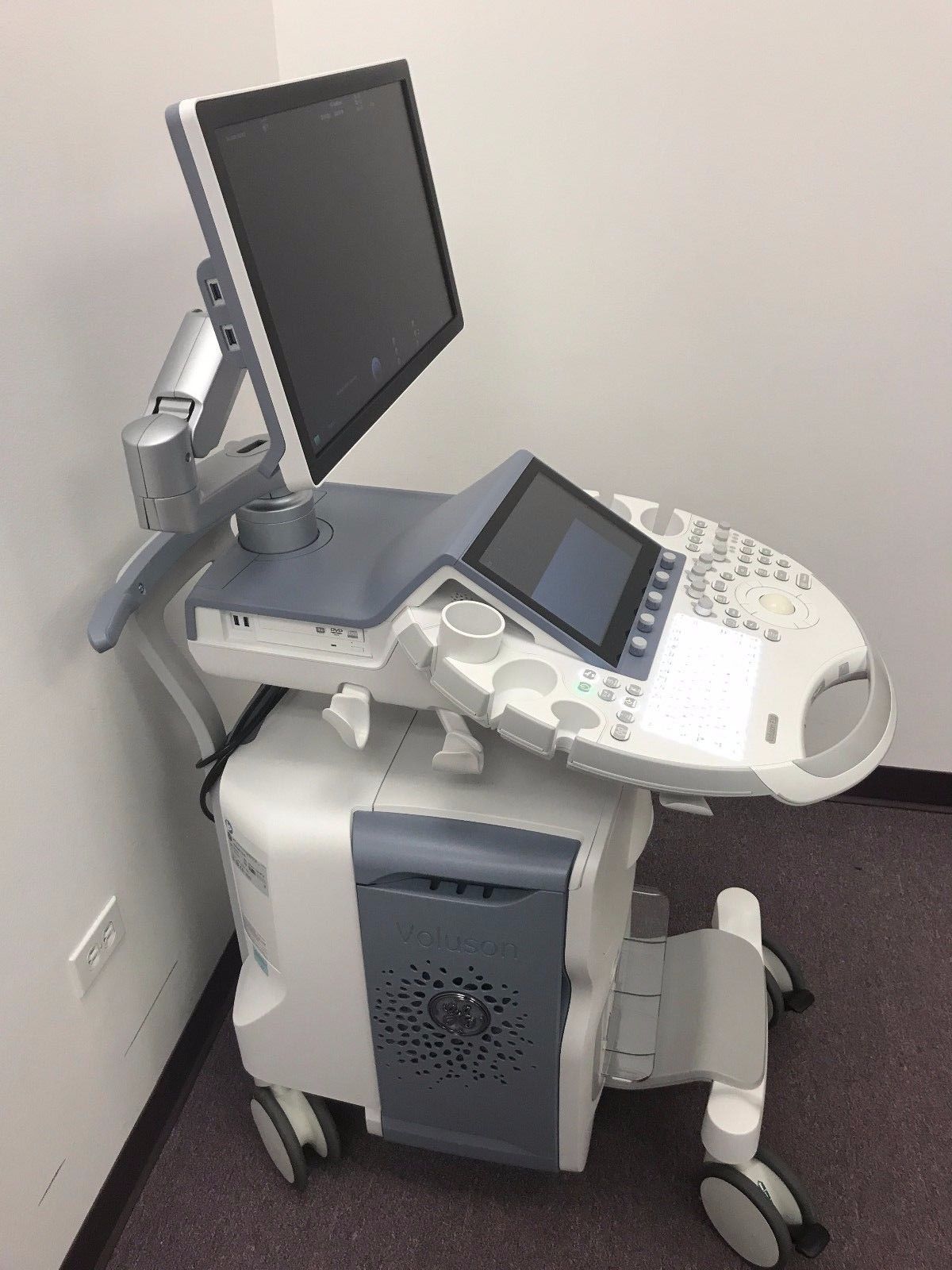 a computer monitor sitting on top of a table